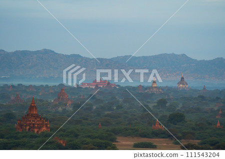 Aerial top view of burmese temples of Bagan City from a balloon, unesco world heritage with forest trees, Myanmar or Burma. Tourist destination. Aerial top view of burmese temples of Bagan City from a balloon, unesco world heritage with forest trees, Myanmar or Burma. Tourist destination. 111543204