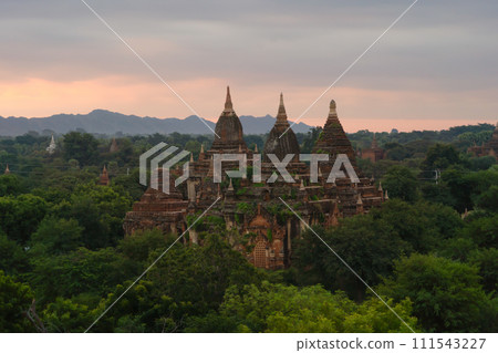 Aerial top view of burmese temples of Bagan City from a balloon, unesco world heritage with forest trees, Myanmar or Burma. Tourist destination. Aerial top view of burmese temples of Bagan City from a balloon, unesco world heritage with forest trees, Myanmar or Burma. Tourist destination. 111543227