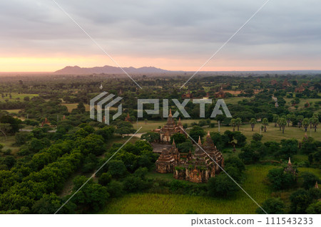 Aerial top view of burmese temples of Bagan City from a balloon, unesco world heritage with forest trees, Myanmar or Burma. Tourist destination. Aerial top view of burmese temples of Bagan City from a balloon, unesco world heritage with forest trees, Myanmar or Burma. Tourist destination. 111543233
