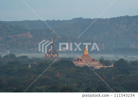 Aerial top view of burmese temples of Bagan City from a balloon, unesco world heritage with forest trees, Myanmar or Burma. Tourist destination. Aerial top view of burmese temples of Bagan City from a balloon, unesco world heritage with forest trees, Myanmar or Burma. Tourist destination. 111543234