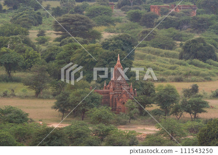 Aerial top view of burmese temples of Bagan City from a balloon, unesco world heritage with forest trees, Myanmar or Burma. Tourist destination. Aerial top view of burmese temples of Bagan City from a balloon, unesco world heritage with forest trees, Myanmar or Burma. Tourist destination. 111543250