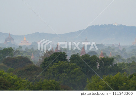 Aerial top view of burmese temples of Bagan City from a balloon, unesco world heritage with forest trees, Myanmar or Burma. Tourist destination. Aerial top view of burmese temples of Bagan City from a balloon, unesco world heritage with forest trees, Myanmar or Burma. Tourist destination. 111543300