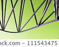 Abstract metal figure on a colorful background, artistically welded metal pipes, fragment of scaffolding in NYC 111543475
