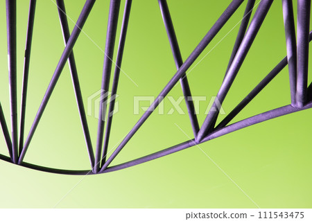 Abstract metal figure on a colorful background, artistically welded metal pipes, fragment of scaffolding in NYC 111543475
