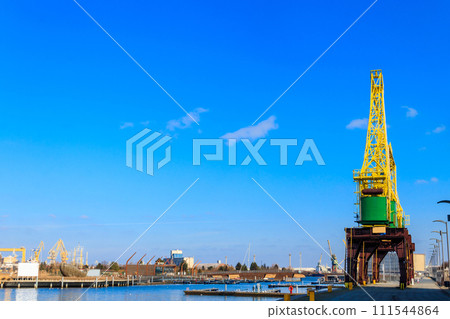 Old cranes on city boulevard in Szczecin, Poland Old cranes on city boulevard in Szczecin, Poland 111544864
