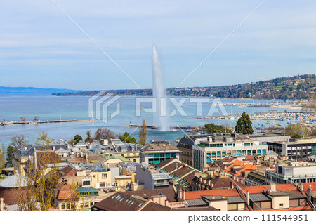 Panoramic view of city of Geneva, Lake Geneva and Jet d'Eau fountain in Switzerland. View from the bell tower of Saint Pierre Cathedral 111544951