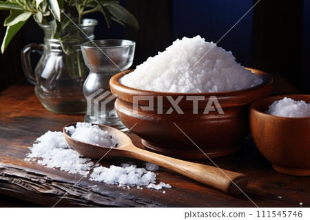 Salt in a bowl on a wooden table. Generative AI 111545746