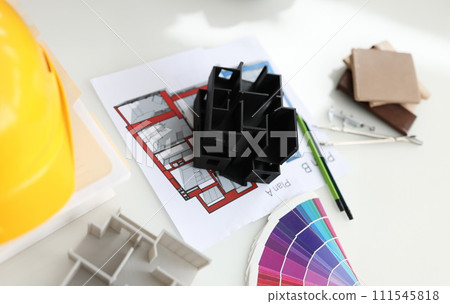 House project and color palette on the table, close-up 111545818