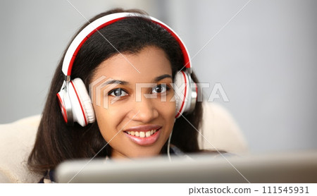 Portrait of a young in white headphones 111545931