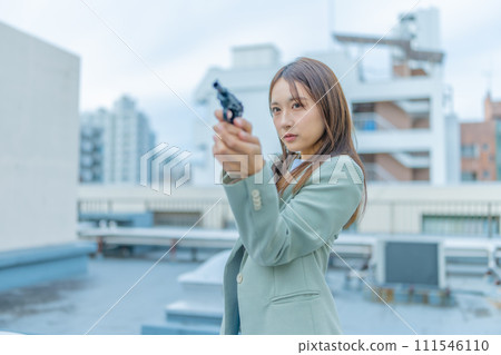 young man with a gun 111546110