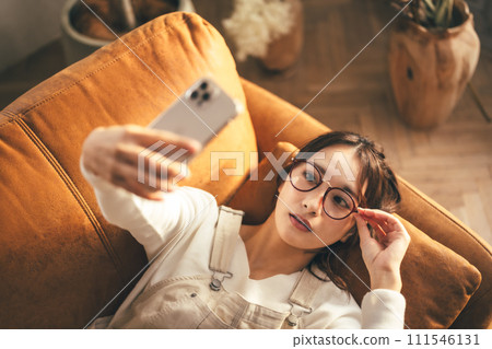 Glasses girl and smartphone 111546131