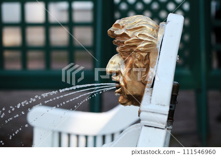 Fountain with golden face mounted on white bench in Peterhof, Fountain with golden face mounted on white bench in Peterhof, 111546960
