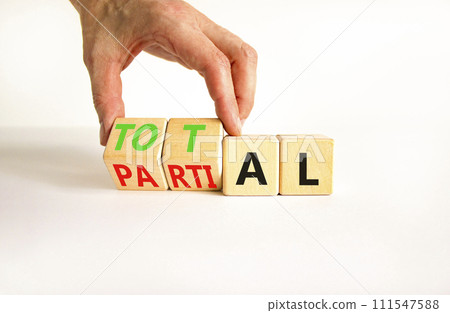 Total or partial symbol. Businessman turns beautiful wooden cubes and changes the word Partial to Total. Beautiful white table white background. Business and total or partial concept. Copy space. Total or partial symbol. Businessman turns beautiful wooden cubes and changes the word Partial to Total. Beautiful white table white background. Business and total or partial concept. Copy space. 111547588