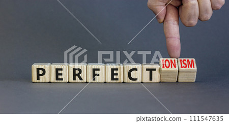 Perfectionism symbol. Concept words Perfect or Perfectionism beautiful wooden blocks. Beautiful grey table grey background. Businessman hand. Business and perfectionism or perfect concept. Copy space. Perfectionism symbol. Concept words Perfect or Perfectionism beautiful wooden blocks. Beautiful grey table grey background. Businessman hand. Business and perfectionism or perfect concept. Copy space. 111547635