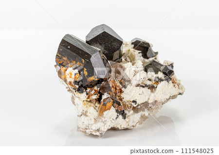 Macro tourmaline mineral stone on white background Macro tourmaline mineral stone on white background 111548025