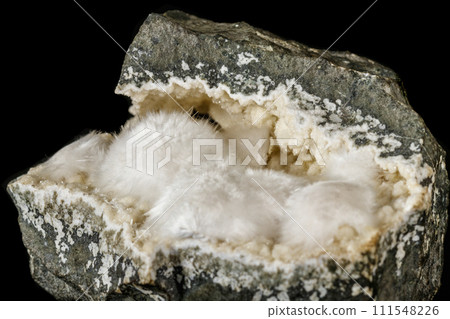 Macro stone Stilbite mineral on white black close up Macro stone Stilbite mineral on white black close up 111548226