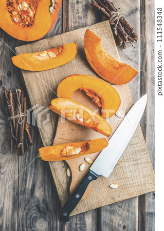 Autumn pumpkins and leaves on a wooden table.Autumn pumpkin thanksgiving background.Halloween. Autumn pumpkins and leaves on a wooden table.Autumn pumpkin thanksgiving background.Halloween. 111548348