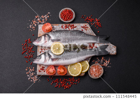 Fresh raw ocean sea bass fish with salt, spices and herbs Fresh raw ocean sea bass fish with salt, spices and herbs 111548445