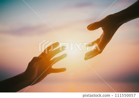 Giving a helping hand on sunset Giving a helping hand on sunset 111550057