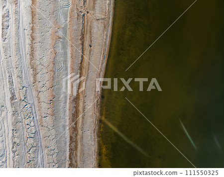 Aerial view over Salton sea in California. Huge lake in the middle of a desert at sunset. 111550325