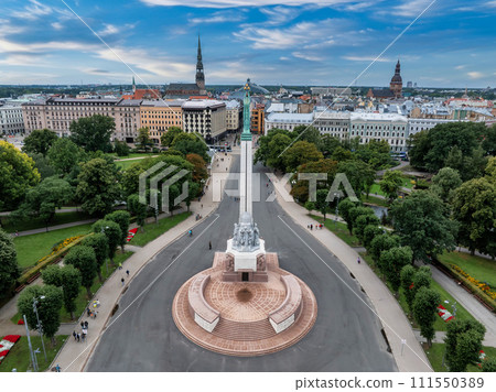 Beautiful sunrise view over Riga by the statue of liberty - Milda in Latvia. The monument of freedom. Beautiful sunrise view over Riga by the statue of liberty - Milda in Latvia. The monument of freedom. 111550389