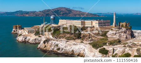 Aerial view of the prison island of Alcatraz in San Francisco Bay, Alcatraz jail in San Francisco bay aerial view. Beautiful aerial view of the Alcatraz island with Golden Gate bridge. 111550416