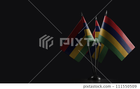 Small national flags of the Mauritius on a black background Small national flags of the Mauritius on a black background 111550509