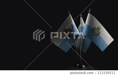Small national flags of the San Marino on a black background Small national flags of the San Marino on a black background 111550511
