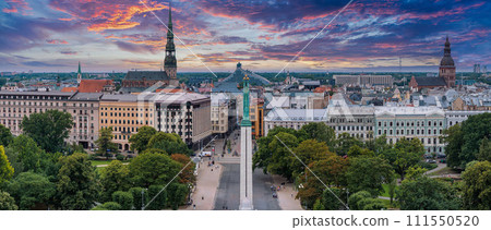 Beautiful sunrise view over Riga by the statue of liberty - Milda in Latvia. The monument of freedom. 111550520