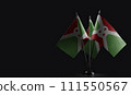 Small national flags of the Burundi on a black background 111550567