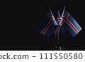 Small national flags of the Iceland on a black background 111550580