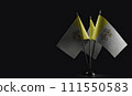Small national flags of the Vatican on a black background 111550583