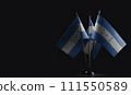 Small national flags of the Honduras on a black background 111550589