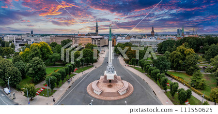 Beautiful sunrise view over Riga by the statue of liberty - Milda in Latvia. The monument of freedom. Beautiful sunrise view over Riga by the statue of liberty - Milda in Latvia. The monument of freedom. 111550625