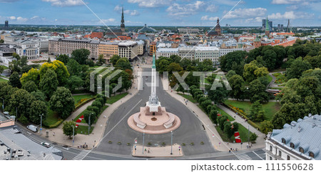 Beautiful sunrise view over Riga by the statue of liberty - Milda in Latvia. The monument of freedom. 111550628
