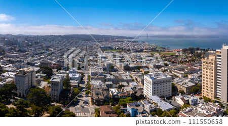 Panoramic view of aerial Lombard Street, an east west street in San Francisco, California. Famous for steep, one block section with eight hairpin turns. Crookedest, steep hills, sharp curves 111550658