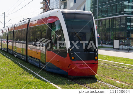 Modern tram on the city street 111550664