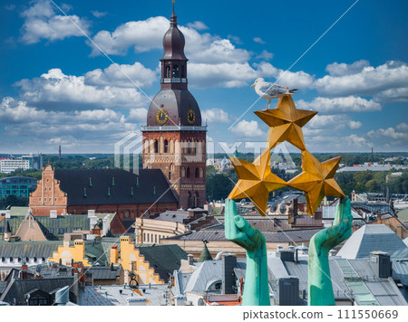 Beautiful sunrise view over Riga by the statue of liberty - Milda in Latvia. The monument of freedom. Beautiful sunrise view over Riga by the statue of liberty - Milda in Latvia. The monument of freedom. 111550669