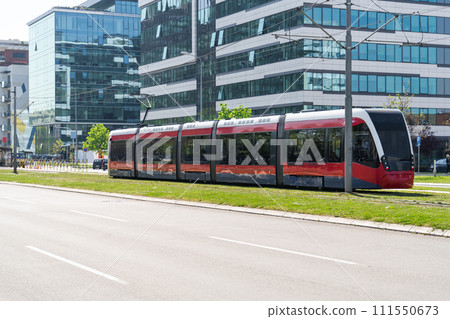 Modern tram on the city street 111550673