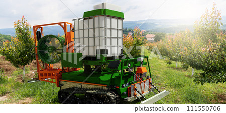 Autonomous robot sprayer works in a fruit garden. Smart farming concept 111550706