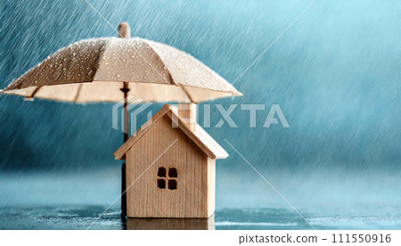 Small wooden house under umbrella in the rain blue background copy space Home insurance and protect Small wooden house under umbrella in the rain blue background copy space Home insurance and protect 111550916