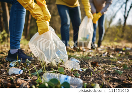 Closeup of volunteer group cleaning up litter in natural environments. Generative AI 111551020