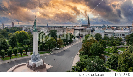 Beautiful sunrise view over Riga by the statue of liberty - Milda in Latvia. The monument of freedom. 111551228