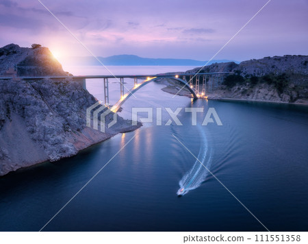 Bridge over the sea at sunset. Aerial view of modern Krk bridge 111551358