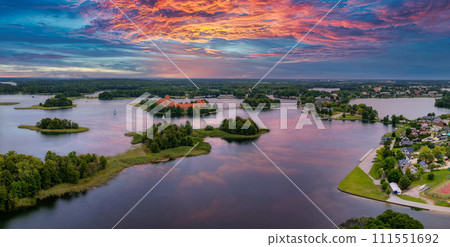 Aerial view of Trakai, over medieval gothic Island castle in Galve lake. Flat lay of the most beautiful Lithuanian landmark. Trakai Island Castle, most popular tourist destination in Lithuania Aerial view of Trakai, over medieval gothic Island castle in Galve lake. Flat lay of the most beautiful Lithuanian landmark. Trakai Island Castle, most popular tourist destination in Lithuania 111551692