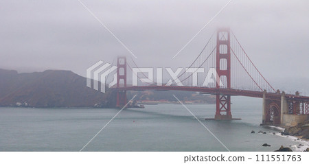 Famous Golden Gate Bridge, San Francisco, USA. San Francisco's Golden Gate Bridge over the clouds 111551763