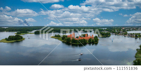 Aerial view of Trakai, over medieval gothic Island castle in Galve lake. Flat lay of the most beautiful Lithuanian landmark. Trakai Island Castle, most popular tourist destination in Lithuania Aerial view of Trakai, over medieval gothic Island castle in Galve lake. Flat lay of the most beautiful Lithuanian landmark. Trakai Island Castle, most popular tourist destination in Lithuania 111551836