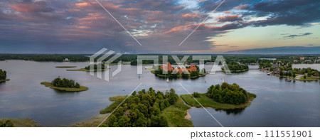 Aerial view of Trakai, over medieval gothic Island castle in Galve lake. Flat lay of the most beautiful Lithuanian landmark. Trakai Island Castle, most popular tourist destination in Lithuania Aerial view of Trakai, over medieval gothic Island castle in Galve lake. Flat lay of the most beautiful Lithuanian landmark. Trakai Island Castle, most popular tourist destination in Lithuania 111551901