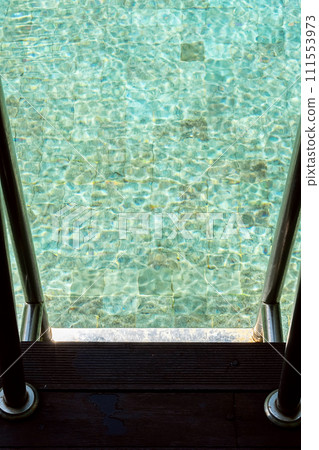 Outdoors swimming pool ladder. Summery vacations. Outdoors swimming pool ladder. Summery vacations. 111553973