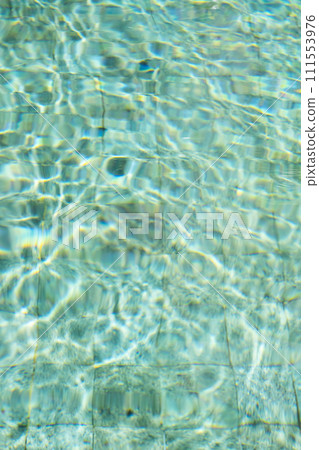 Sunshine through the ripples of water in swimming pool. Sunshine through the ripples of water in swimming pool. 111553976